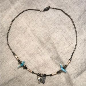 Vintage butterfly and bluebird necklace.